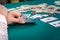 Combination of two aces in female hands on poker table