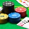 Combinations of playing cards and bright columns of poker chips