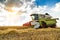 Combine harvester in action on wheat field