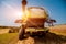 Combine harvester in action on wheat field. Process of gathering a ripe crop.