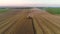 Combine harvester agriculture machine harvesting golden ripe wheat field, 4k video
