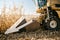 Combine harvester collecting corn and harvesting during fall season.