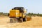 Combine harvester harvesting barley fields