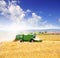 Combine harvester harvesting wheat cereal