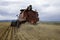 Combine harvester, harvesting wheat, just before a thunderstorm, in Kwazulu Natal, South Africa