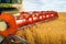 Combine harvester harvests ripe wheat. Agriculture image