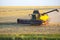 Combine harvester harvests wheat in the field. agronomy and grain industry