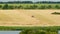 Combine harvester plowing a field