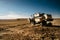 Combine harvester at sunset finishing a days work