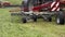 Combine harvester tractor carriage packing cutted grass on field