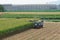 Combine harvester and tractor used in corn harvesting