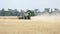 Combine harvester on the wheat field, Green harvester working on the field, view on the combines and tractors working on