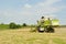 Combine harvester in the wheat field during harves