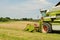 Combine harvester in the wheat field during harves