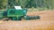 Combine harvester working on golden wheat field