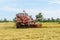 Combine harvester Working on rice field. Harvesting is the process of gathering a ripe crop from the fields