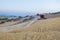 Combine harvester working on sloping ground, Spain