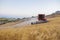 Combine harvester working on sloping ground, Spain