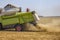 Combine harvester working on a wheat field.