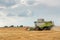 Combine harvester working on a wheat field. Harvesting wheat.