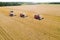 Combine harvesters reaping wheat top view from a drone