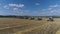 Combine harvesters remove wheat. Aerial