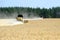 Combine harvesters working on a wheat field