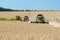 Combine harvesters working on a wheat field