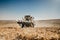 Combine harvesting the corn at sunset hours, agriculture industry