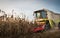 Combine harvesting crop corn