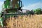 Combine harvesting soybeans