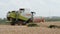 Combine harvesting wheat