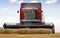 Combine harvesting wheat