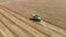 Combine harvesting a wheat field in summer