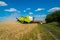 combine harvests grain harvest in the field, Russia