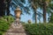 Combine hedge and cement fence with a ceramic ornament