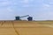 Combine loading harvest into grain cart