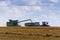 Combine loading harvest into grain cart