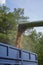 The combine pours wheat into the tractor trailer with a grain auger.