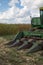 Combine tractor in corn field