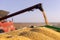 Combine transferring soybeans after harvest