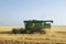 Combine on wheat field