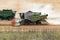 Combined harvester collects the crop residues on the cutover field during harvesting