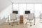 Combined office desk in panoramic white space with wood floor