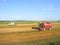 Combines harvester works at field, Belarus