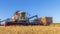 Combines and other equipment in the fields during the wheat harvest