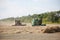 The combines to harvest on the field.