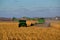 Combines working in North Dakota to harvest corn