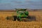 Combines working in North Dakota to harvest corn