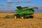 Combines working in North Dakota to harvest corn